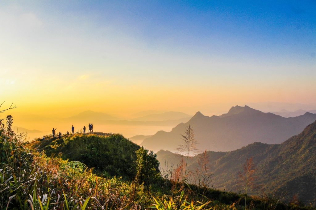 photo of people standing on top of mountain near grasses 733162 1024x682.jpg